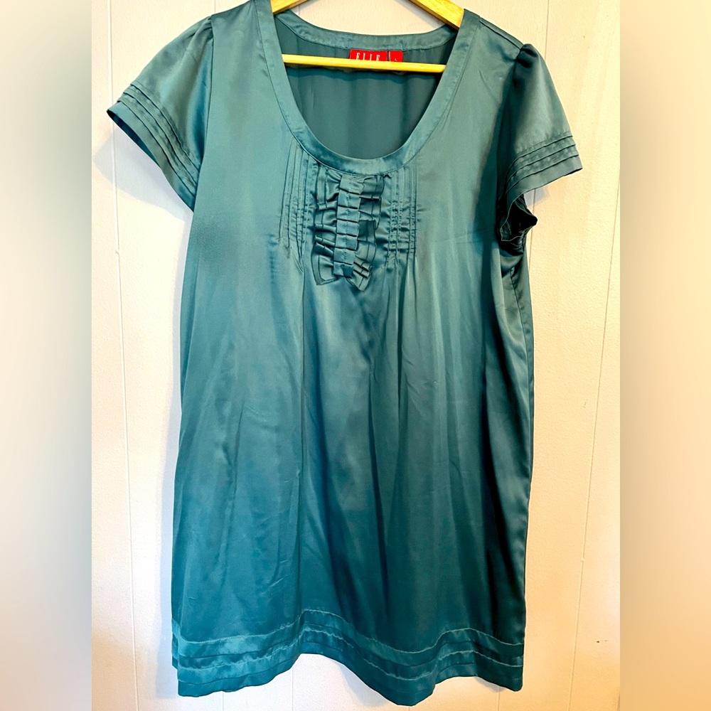 Satin mini dress with ruffle detail.